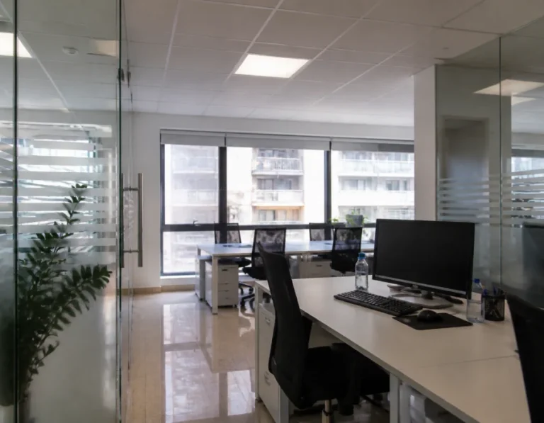 Open office with glass partitions and clean desks